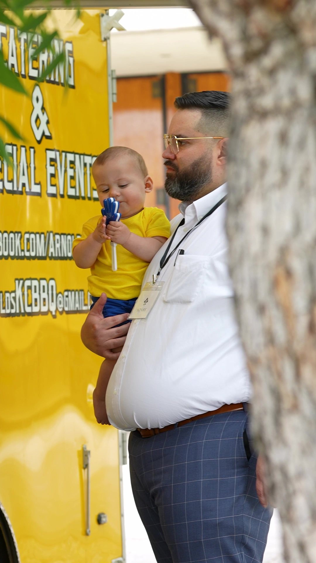 An attendee being handed a conference program at a booth