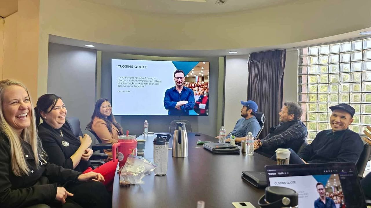 A member presenting to the room during a weekly meeting